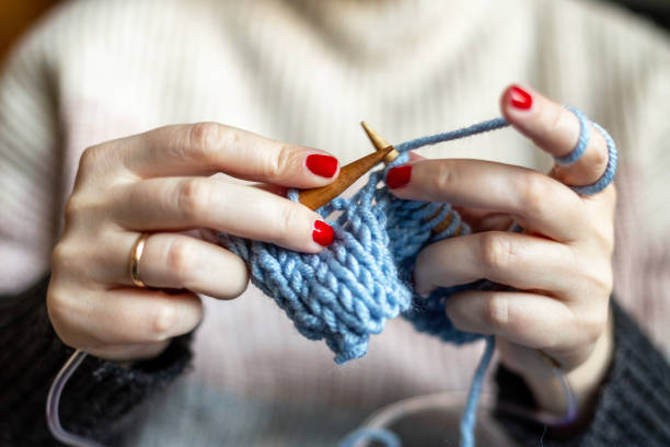 istock Hands of a woman knitting. 2056892907