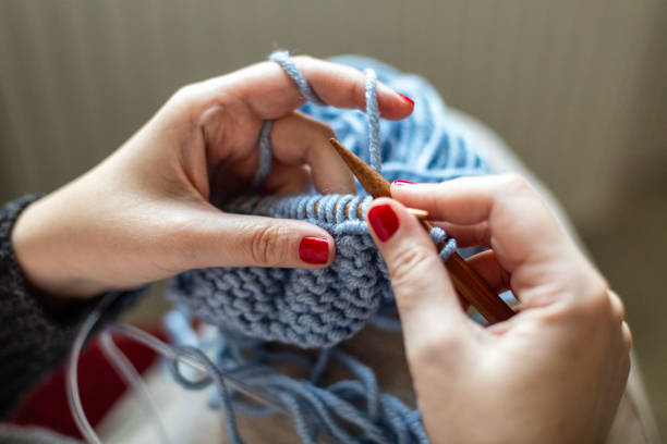 istock Hands of a woman knitting. 2056892911