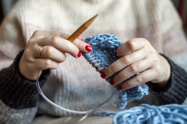 istock Hands of a woman knitting. 2056892913