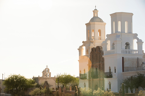 Built in 1797, afternoon light shines on the historic Spanish colonial era San Xavier del Bac Mission in Tucson, Arizona, USA.