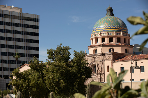 Afternoon light sines on the Pima County Historic Courthouse and downtown skyline of Tucson, Arizona, USA.