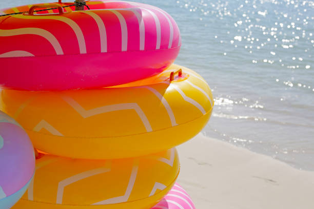 istock Inflatable rings on the beach. Summer concept 2056958980