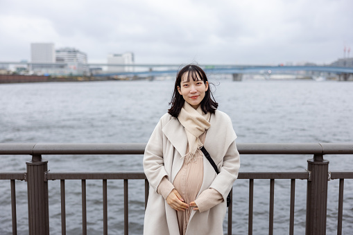 Portrait of pregnant woman at the port of Tokyo Bay