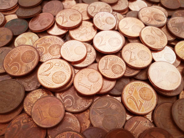 1 cent euro coins, 2 cent euro coins and 5 cent euro coins. Pile of euro cent coins.