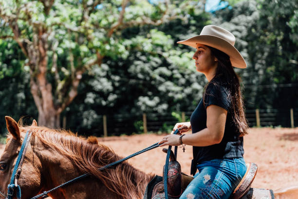 istock Cowgirl riding her horse 2057159462