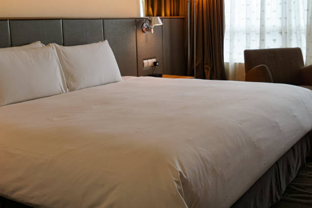 istock Bed with pillows, headboard in bedroom 2057168692