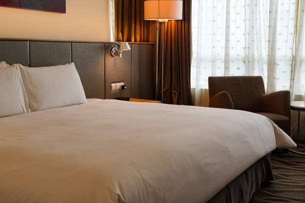 istock Bed with pillows, headboard in bedroom 2057168699