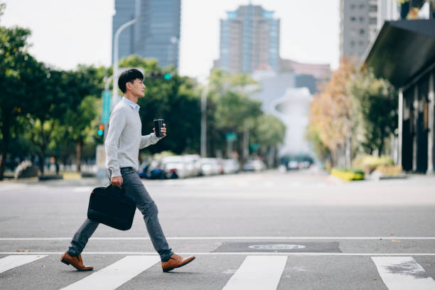 istock A business man walking in the business district 2057190724