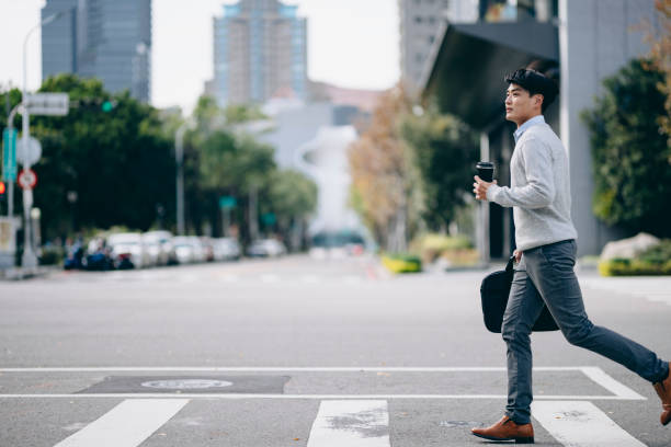 istock A business man walking in the business district 2057190725