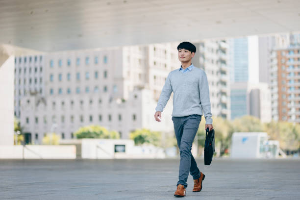 istock A business man walking in the business district 2057191253