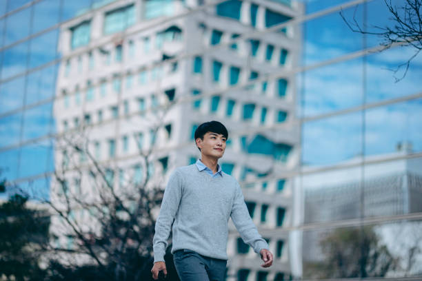 istock A business man walking in the business district 2057191762