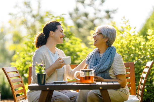 istock women drinking tea in the garden 2057205787
