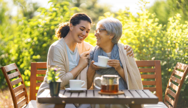 istock women drinking tea in the garden 2057205823