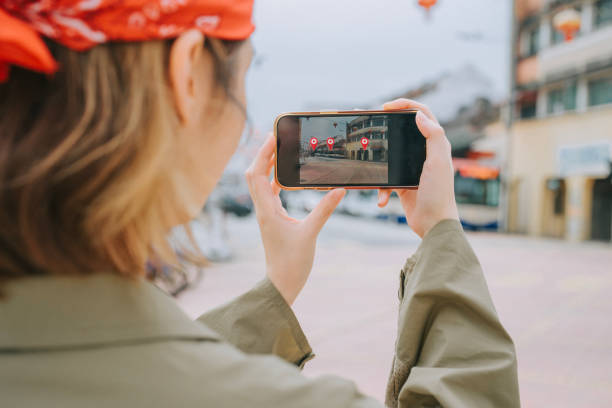 istock Asian Chinese female tourist using mobile app navigation tool in Penang Old Town 2057206815