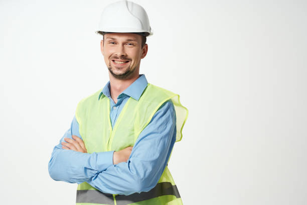istock man in construction uniform white helmet safety studio 2057242683