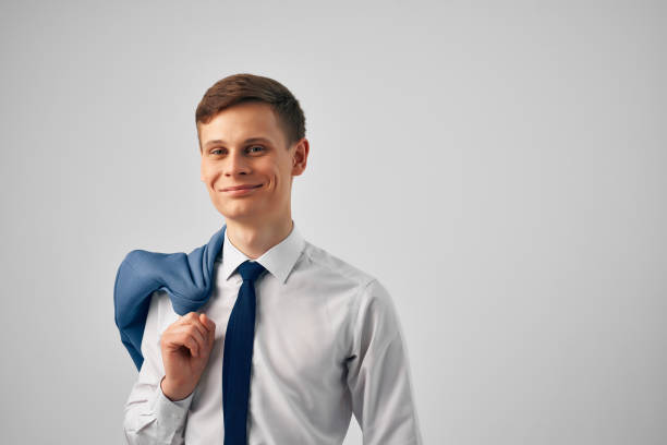 business man in shirt with tie jacket on shoulder successful manager office. High quality photo