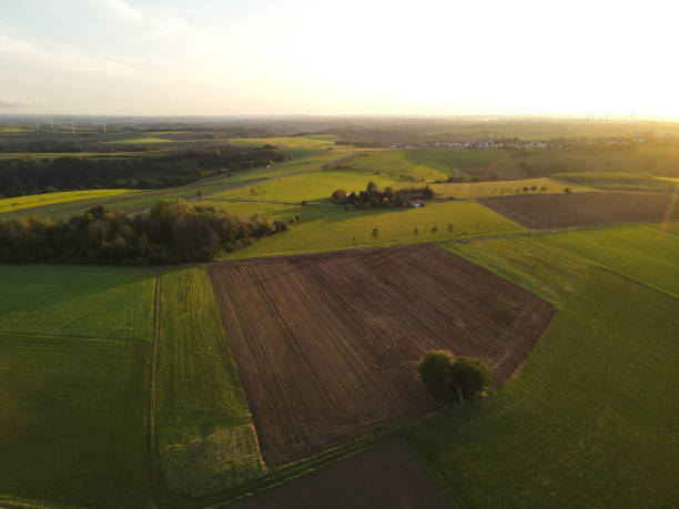 istock View from above of farmland with fields during sunset 2057287379