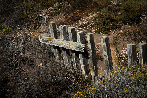 An old faded picket fence on the coast of Big Sur, California