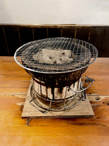 Image of charcoal and seven wheels placed on an indoor table
