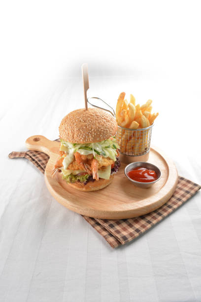 chef handmade deep fried crispy chicken tempura prawn cheesy burger with French fries and sauce in plate restaurant western fast food cafe halal menu chef handmade deep fried crispy chicken tempura prawn cheesy ramly burger with French fries and sauce in plate restaurant western fast food cafe halal menu kopitiam egg stock pictures, royalty-free photos & images