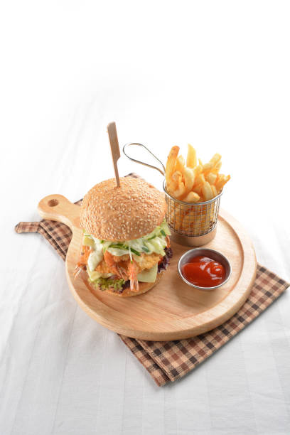 chef handmade deep fried crispy chicken tempura prawn cheesy burger with French fries and sauce in plate restaurant western fast food cafe halal menu chef handmade deep fried crispy chicken tempura prawn cheesy ramly burger with French fries and sauce in plate restaurant western fast food cafe halal menu kopitiam egg stock pictures, royalty-free photos & images