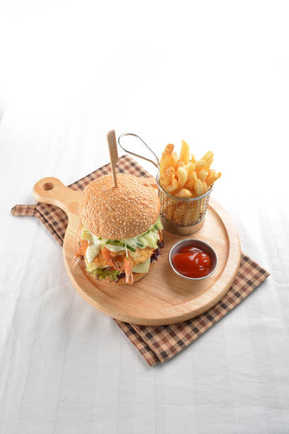 chef handmade deep fried crispy chicken tempura prawn cheesy burger with French fries and sauce in plate restaurant western fast food cafe halal menu chef handmade deep fried crispy chicken tempura prawn cheesy ramly burger with French fries and sauce in plate restaurant western fast food cafe halal menu kopitiam egg stock pictures, royalty-free photos & images