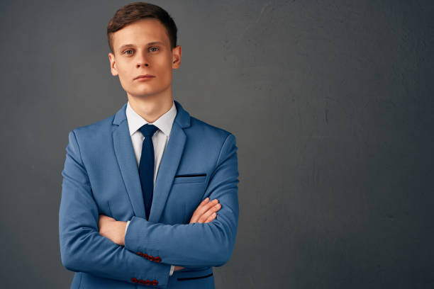 istock business man in suit with tie self confidence posing isolated background 2057347457