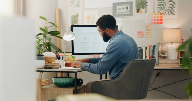 istock Night, desk and a black man with a notebook for planning of work goals, target or ideas for a project. Workspace, strategy and an African businessman writing for deadline inspiration or notes 2057368191