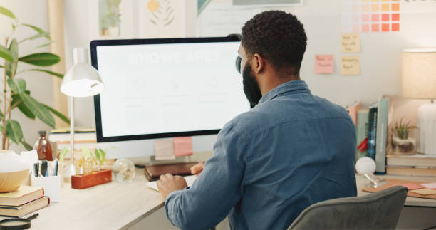 istock Night, desk and a black man with a notebook for planning of work goals, target or ideas for a project. Workspace, strategy and an African businessman writing for deadline inspiration or notes 2057368200