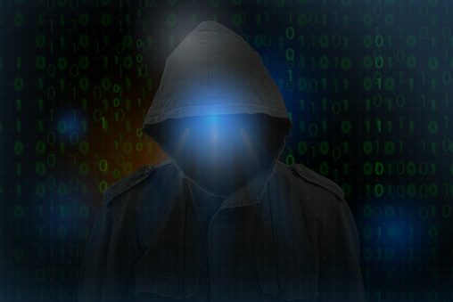 Anonymous computer hacker over abstract digital background. cyberhacks data security concept