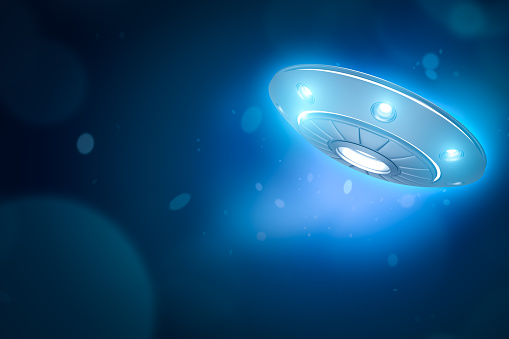3d rendering of UFO with glowing lights on blue bokeh background with copy space. Ufology. Mysteries and puzzles. \
