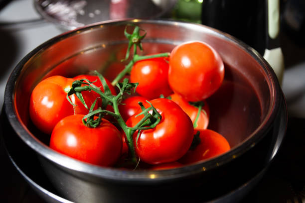 istock Fresh Vine Tomatoes in Stainless Steel Bowl 2057407471