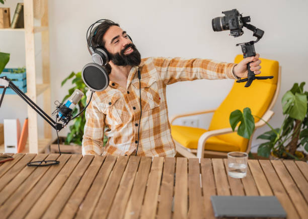 istock man at home streamingwith camera and headphones influencer 2057414377