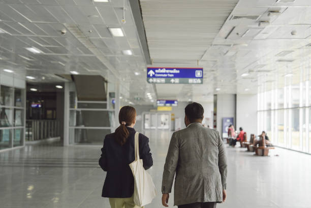 istock Two business people walking in the train station 2057419628