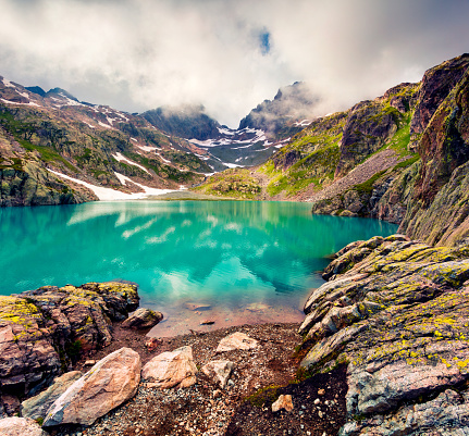 Colorful summer morning on the Lac Blanc lake with Belvedere peack on background, Chamonix location. Beautiful outdoor scene in Vallon de Berard Nature Preserve, Graian Alps, France, Europe.