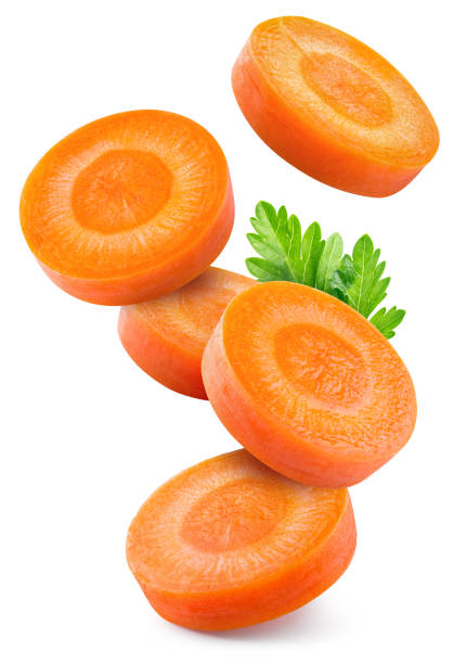 istock Carrot slice isolated. Carrots with parsley flying on white background. Perfect retouched carrot slices isolate. Full depth of field. 2057482804