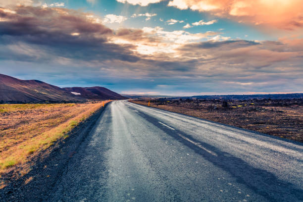 istock Empty asphalt road with colorful cloudy sky. 2057495427
