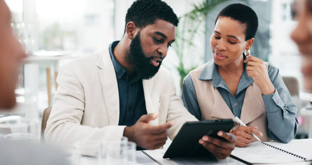 istock Business people, meeting or group with a tablet, teamwork or conversation with cooperation, budget planning or collaboration. Staff, manager or employee with tech, productivity, finance or accounting 2057497563