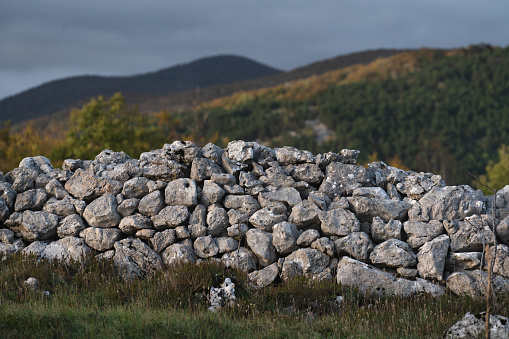 Landscape with stone wall in Croatian mountains.