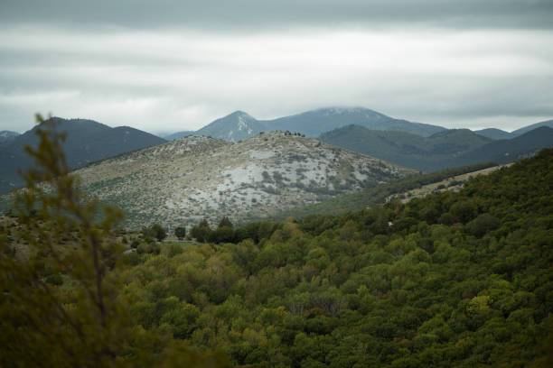 Croatian mountains with low hanging clouds in late summer.