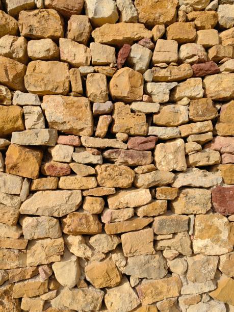 istock Stone wall fence rustic decoration natural background 2057506528
