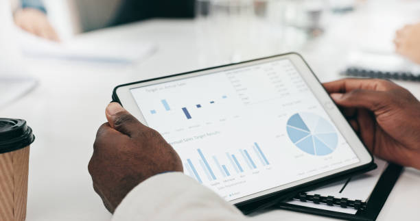 istock Business hands, screen and tablet for data analytics, graphs and chart or marketing profit, increase and planning in meeting. Professional people and clients with infographics on digital technology 2057508113