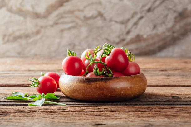 fresh tomato on wooden background stock photo