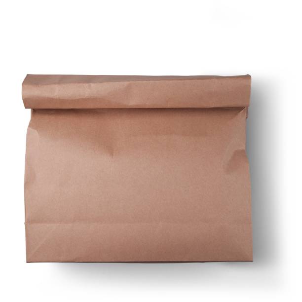 Reusable paper bag for carrying goods isolated on plain background.