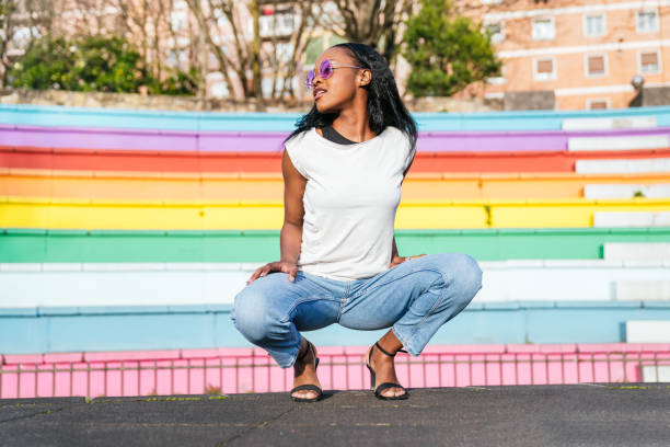 Afro-American Woman Posing Powerfully on LGBT Colored Steps