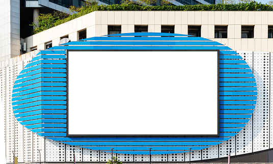 Mock up white large LED display horizontal billboard on shopping mall building .clipping path for mockup