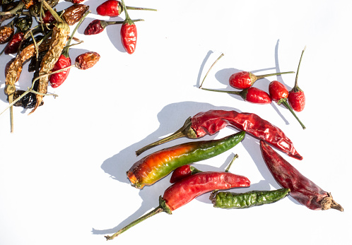 Delicious red chili peppers, isolated on white background