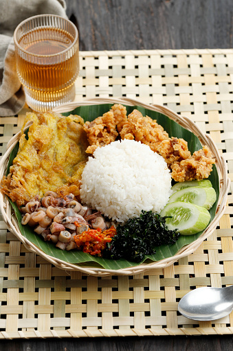 Nasi Rames or Indonesian Mix Rice, Steamed Rice with Various Side Dish. Served with Tea