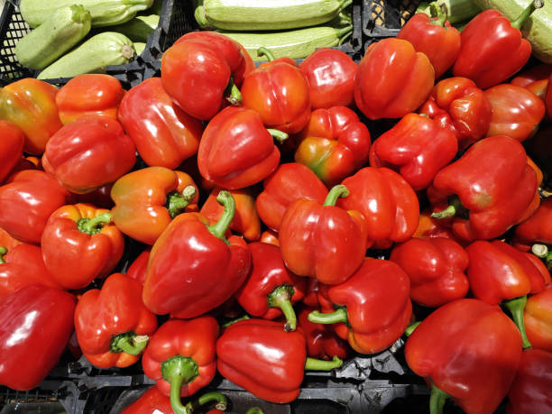 istock Raw red bell pepper in plastic basket on the shelf 2057594380
