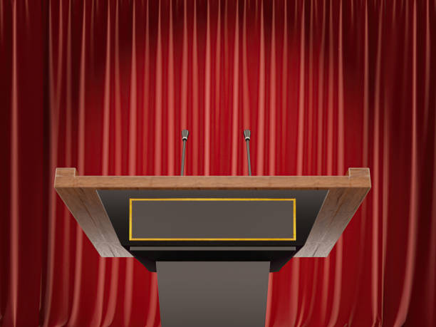 istock Wooden Conference Podium with Red Curtains 2057602615